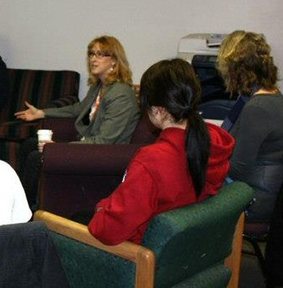 Jodi discussing books at a library.
